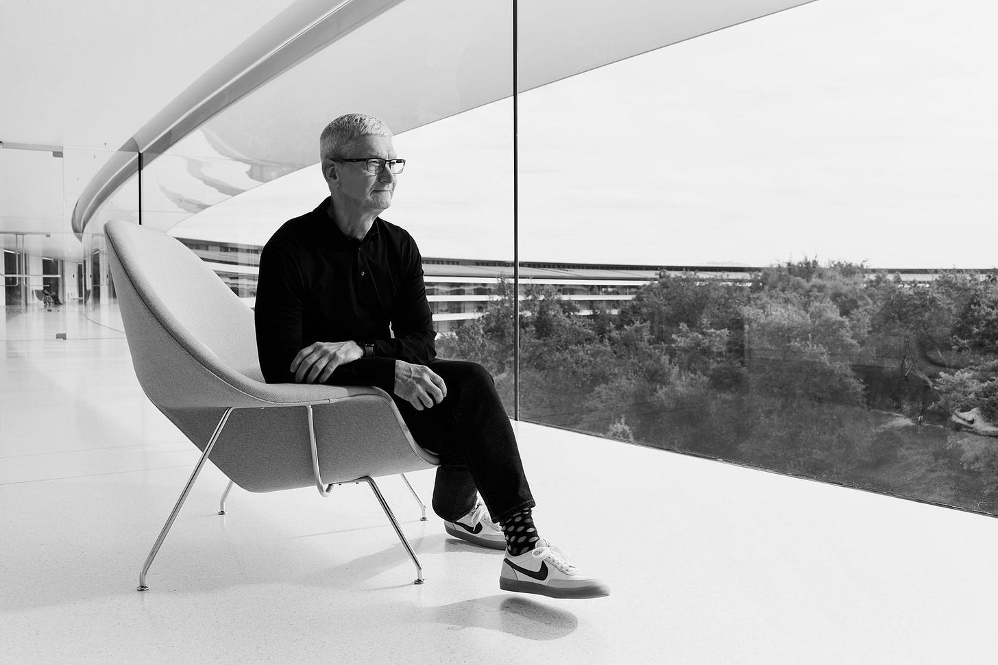 Image may contain Tim Cook Person Sitting Chair Furniture Adult Accessories Glasses Clothing Footwear and Shoe Image may contain Tim Cook Person Sitting Chair Furniture Adult Accessories Glasses Clothing Footwear and Shoe