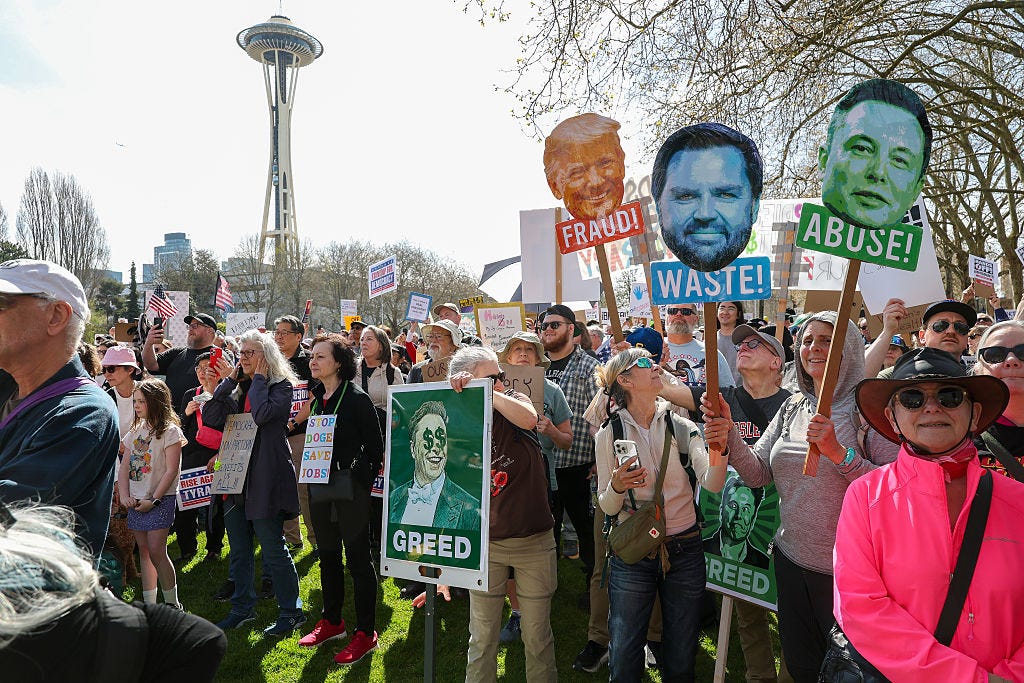 Demonstrators attend the nationwide “Hands Off!” protest against US President Donald Trump and his advisor, Tesla CEO Elon Musk at the Seattle Center on April 05, 2025 in Seattle, Washington. 