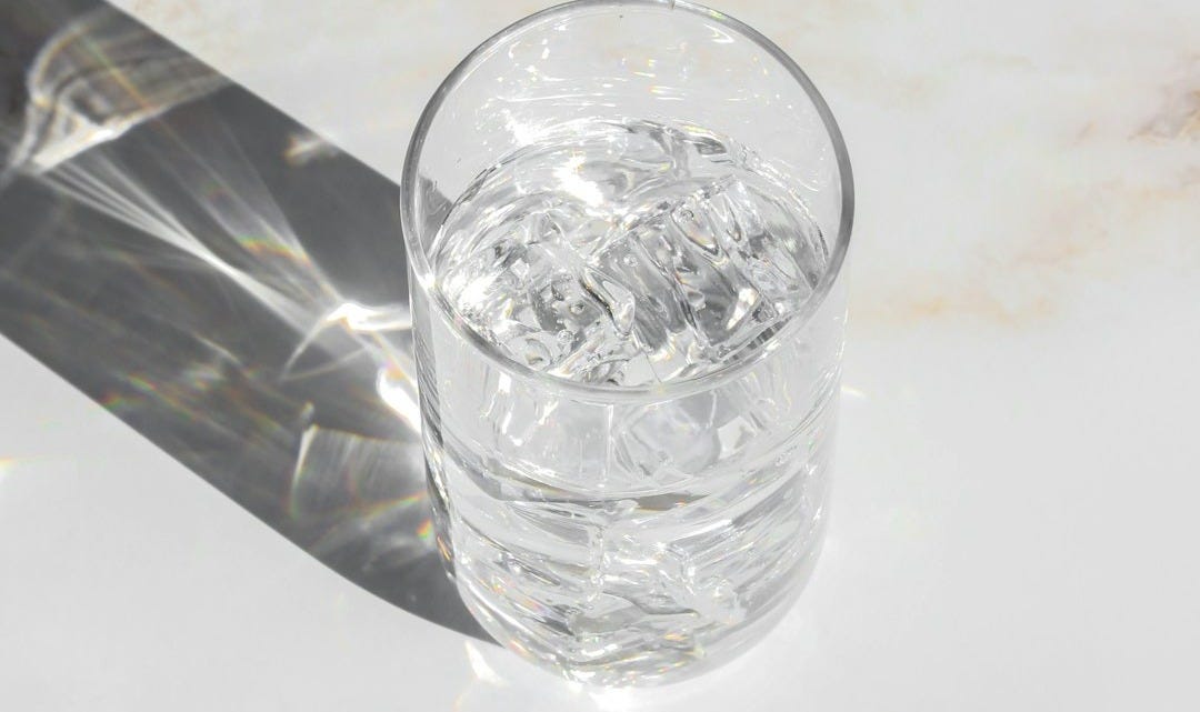 clear drinking glass on white table