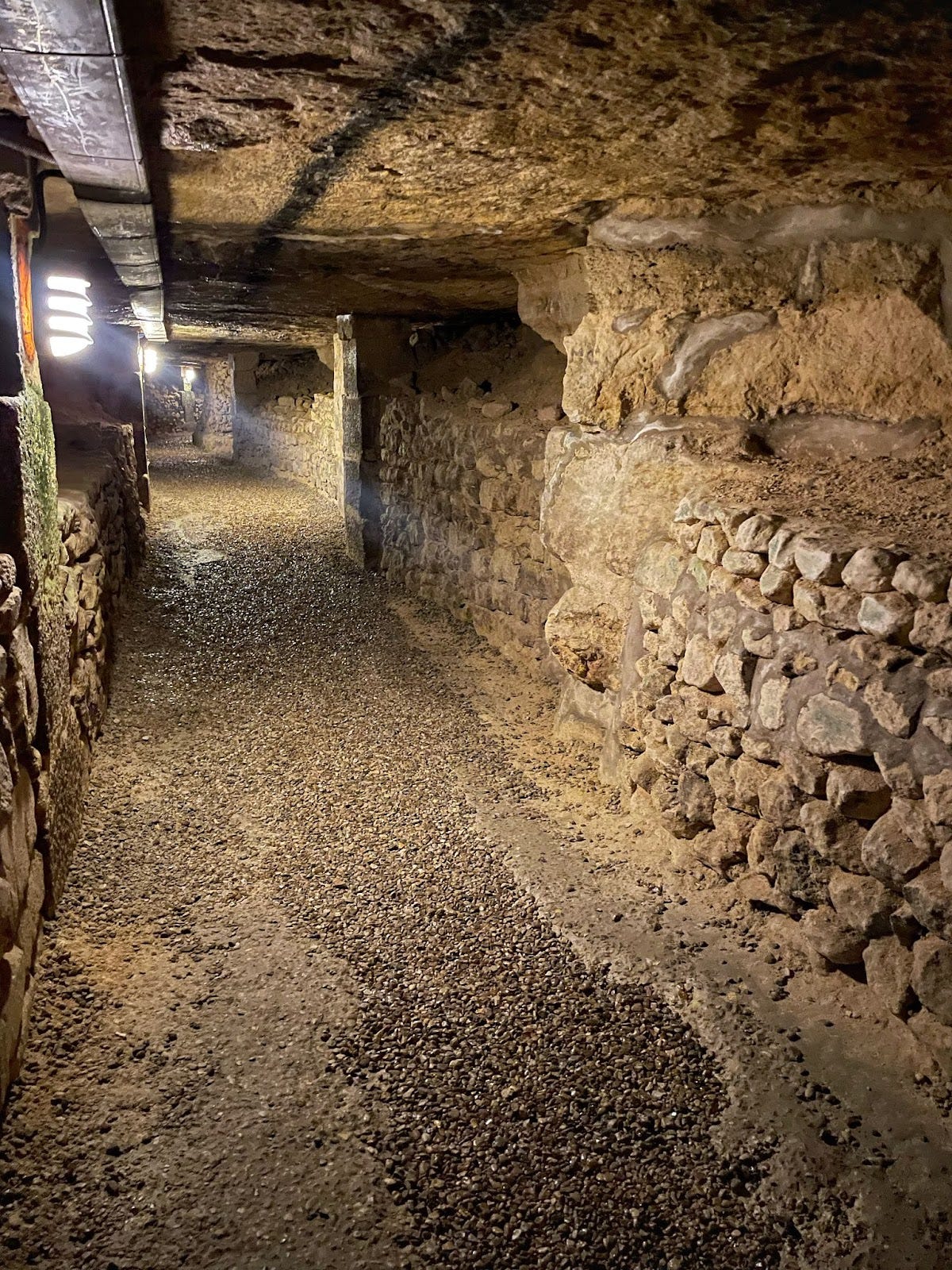 Paris catacombs - corridor with the "lifeline" on the ceiling