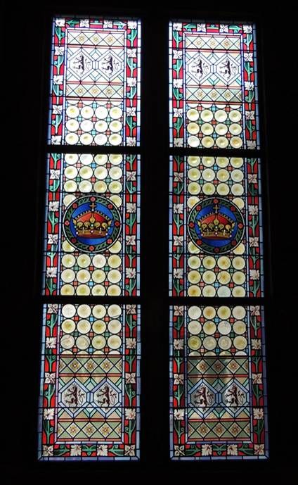A stained glass window in a dark room

AI-generated content may be incorrect.