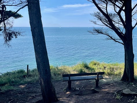 A collection of nine photos taken in Brittany, featuring a group of four friends on a hike and eight scenic coastal landscapes, including lighthouses, cliffs, boats, and traditional villages under varied summer light