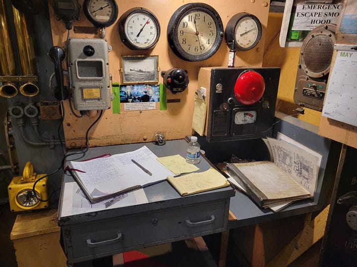 The draft fan, the throttle wheel, the chief's desk and a pressure gauge.