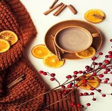 Cup of hot cocoa with cinnamon sticks