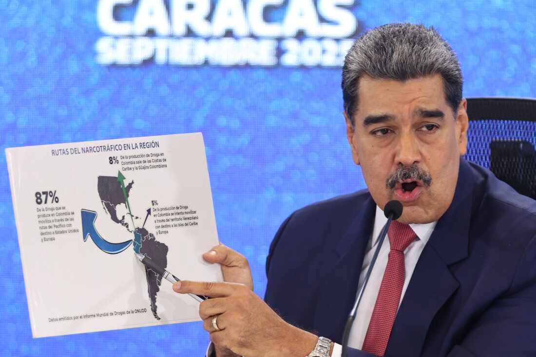 Venezuelan President Nicolas Maduro points at a map of the Americas during a press conference in Caracas, Venezuela, on Monday.