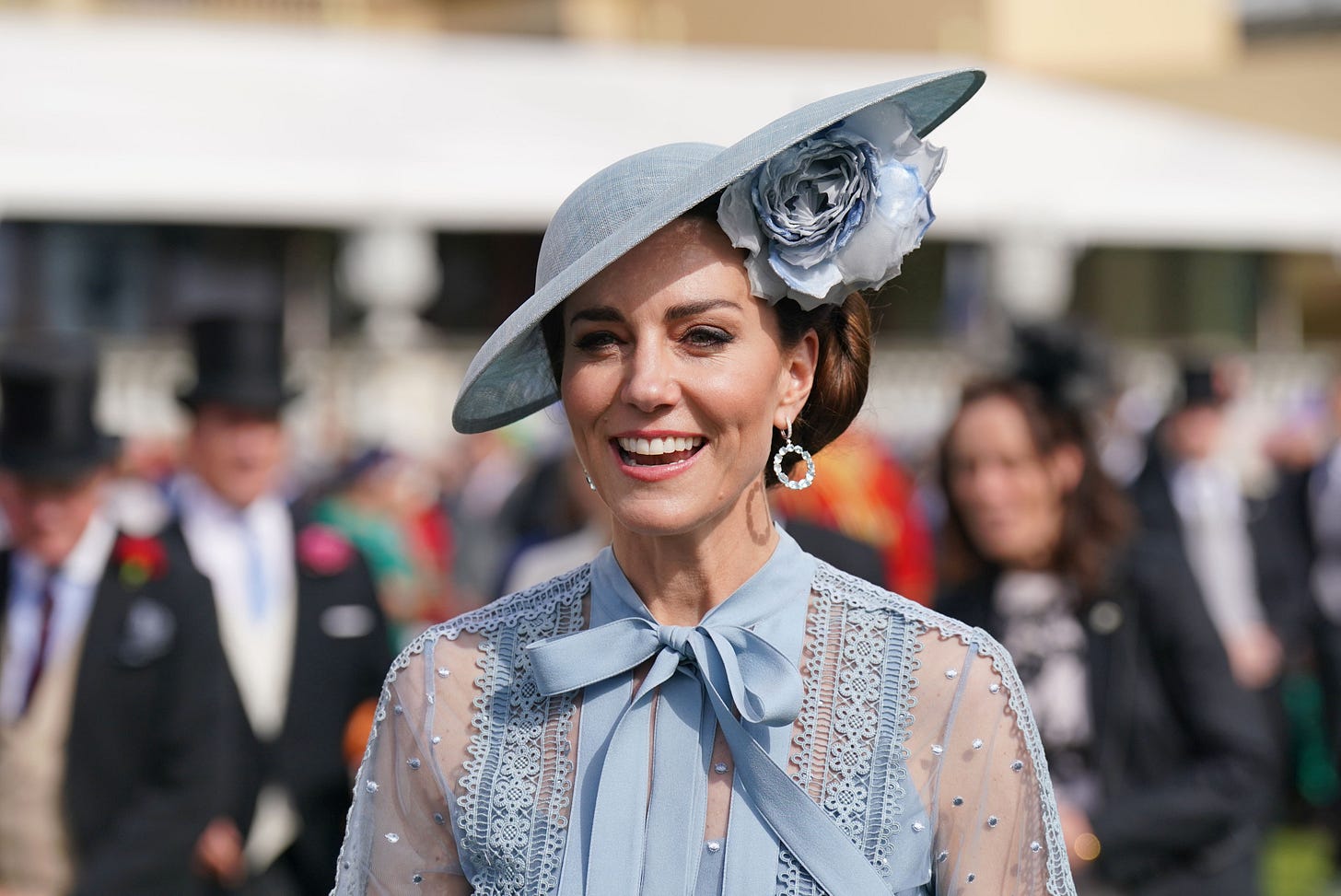 Kate Middleton wearing blue dress and hat at garden party