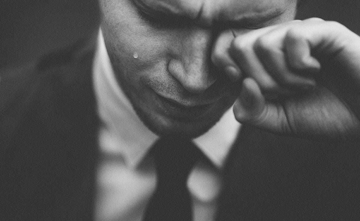A man who is currently unemployed crying because of his finished unemployment stimulus.