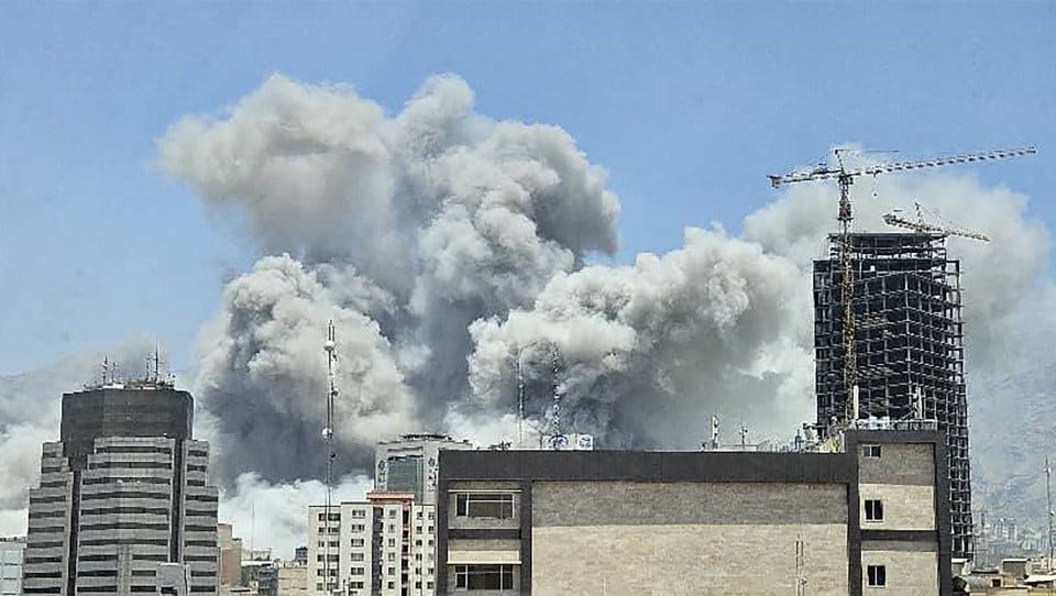 This UGC image posted on social media on June 23, 2025 shows a plume of smoke billowing after Israeli strikes in Tehran the same day. Israel said it struck Iran Revolutionary Guards sites in Tehran and the city's notorious Evin prison on June 23, instensifying its attacks a day after the United States hit the Islamic republic's nuclear facilities (Photo by UGC / AFP) / RESTRICTED TO EDITORIAL USE - MANDATORY CREDIT "AFP PHOTO / UGC / ANONYMOUS " - NO MARKETING NO ADVERTISING CAMPAIGNS -NO ACCESS ISRAEL MEDIA/PERSIAN LANGUAGE TV STATIONS OUTSIDE IRAN/ STRICTLY NO ACCESS BBC PERSIAN/ VOA PERSIAN/ MANOTO-1 TV/ IRAN INTERNATIONAL/RADIO FARDA - AFP IS NOT RESPONSIBLE FOR ANY DIGITAL ALTERATIONS TO THE PICTURE'S EDITORIAL CONTENT / (Photo by -/UGC/AFP via Getty Images)