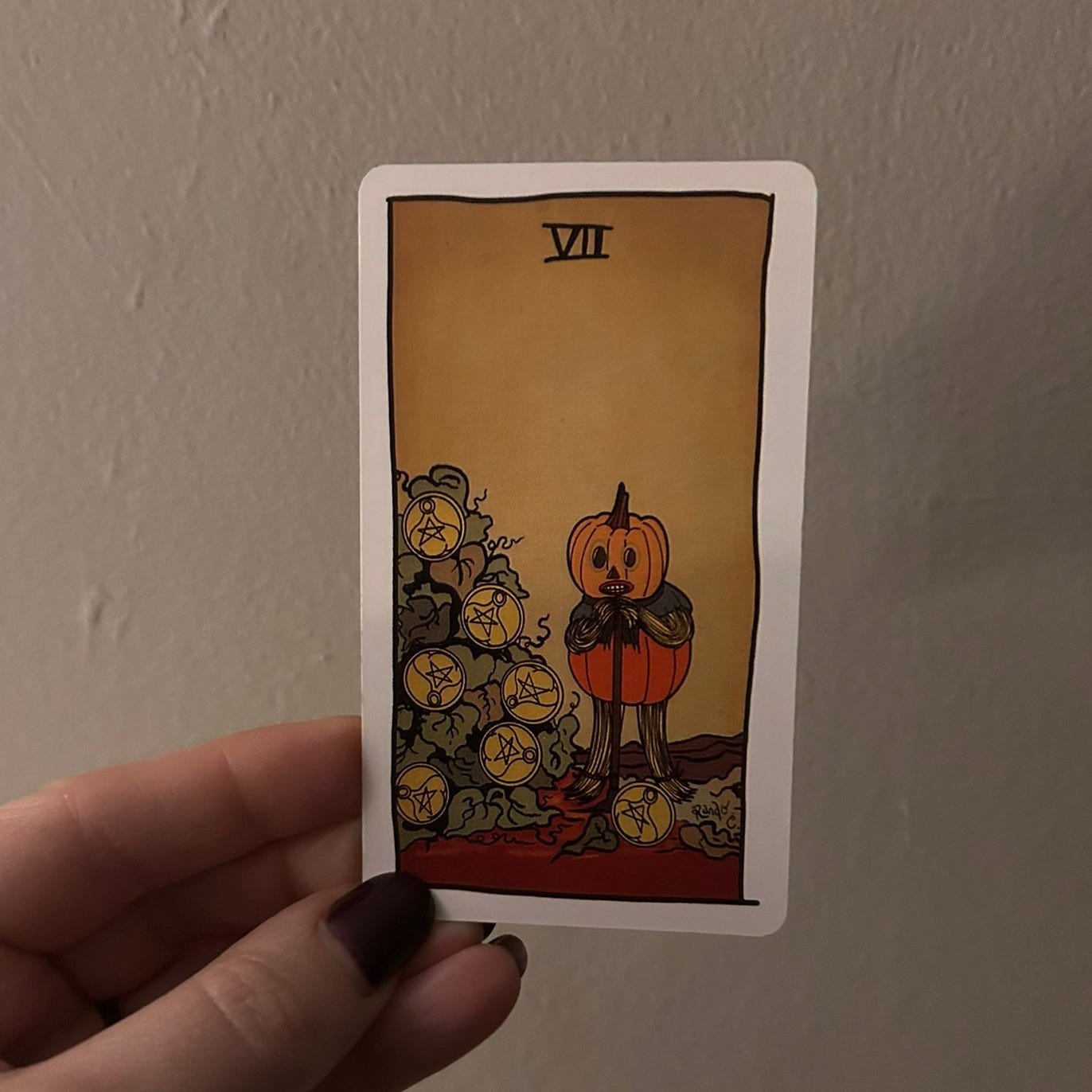 Seven of Pentacles tarot card illustrated with pumpkin-headed figure beside pentacle vines - symbol of patience and creative growth selected for next Tarot DMs guest. Seven of Pentacles tarot card illustrated with pumpkin-headed figure beside pentacle vines - symbol of patience and creative growth selected for next Tarot DMs guest.