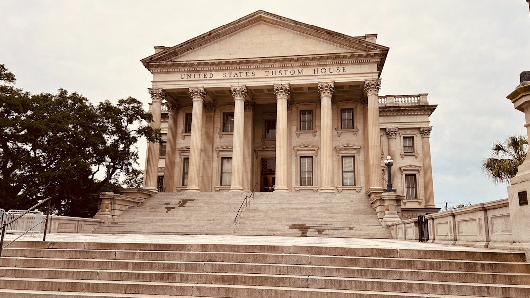 a large building with columns and steps leading up to it