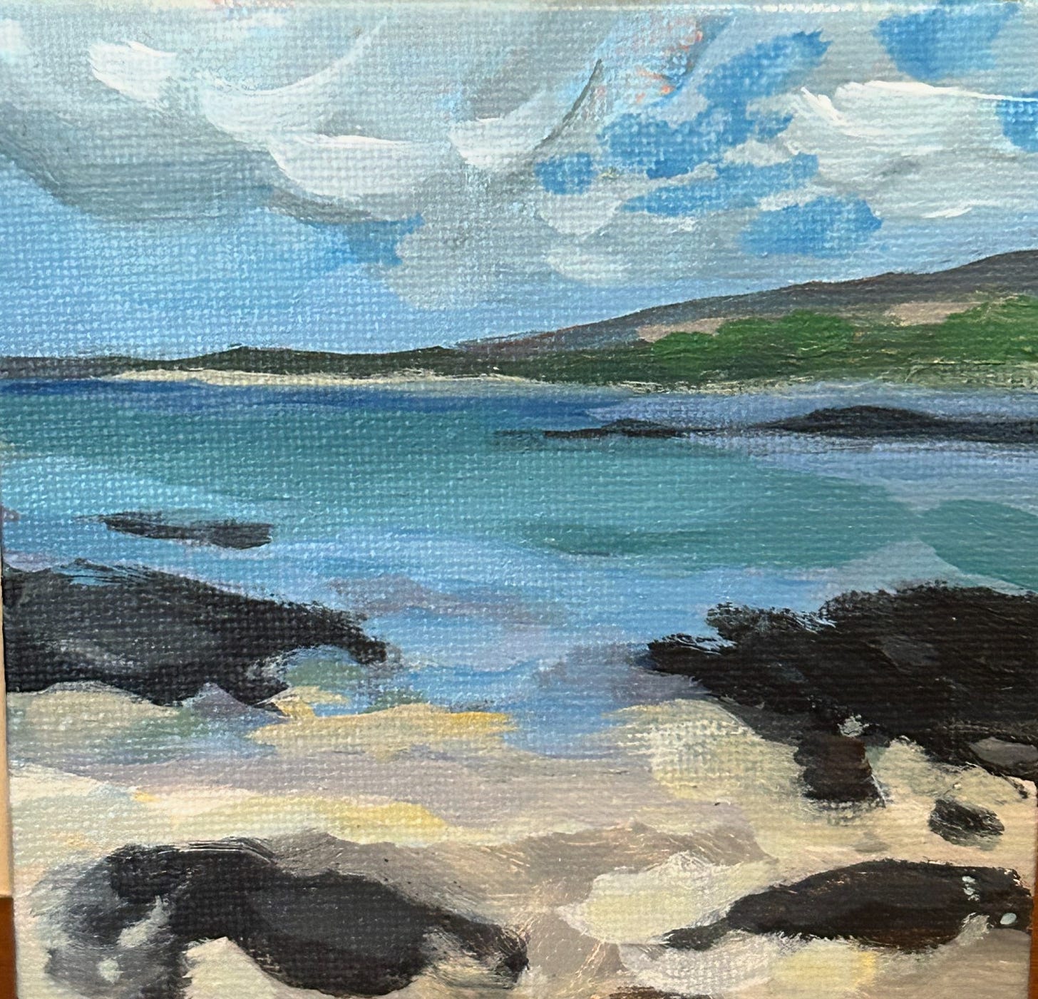 painting of a big sky over a beach with dark rocks