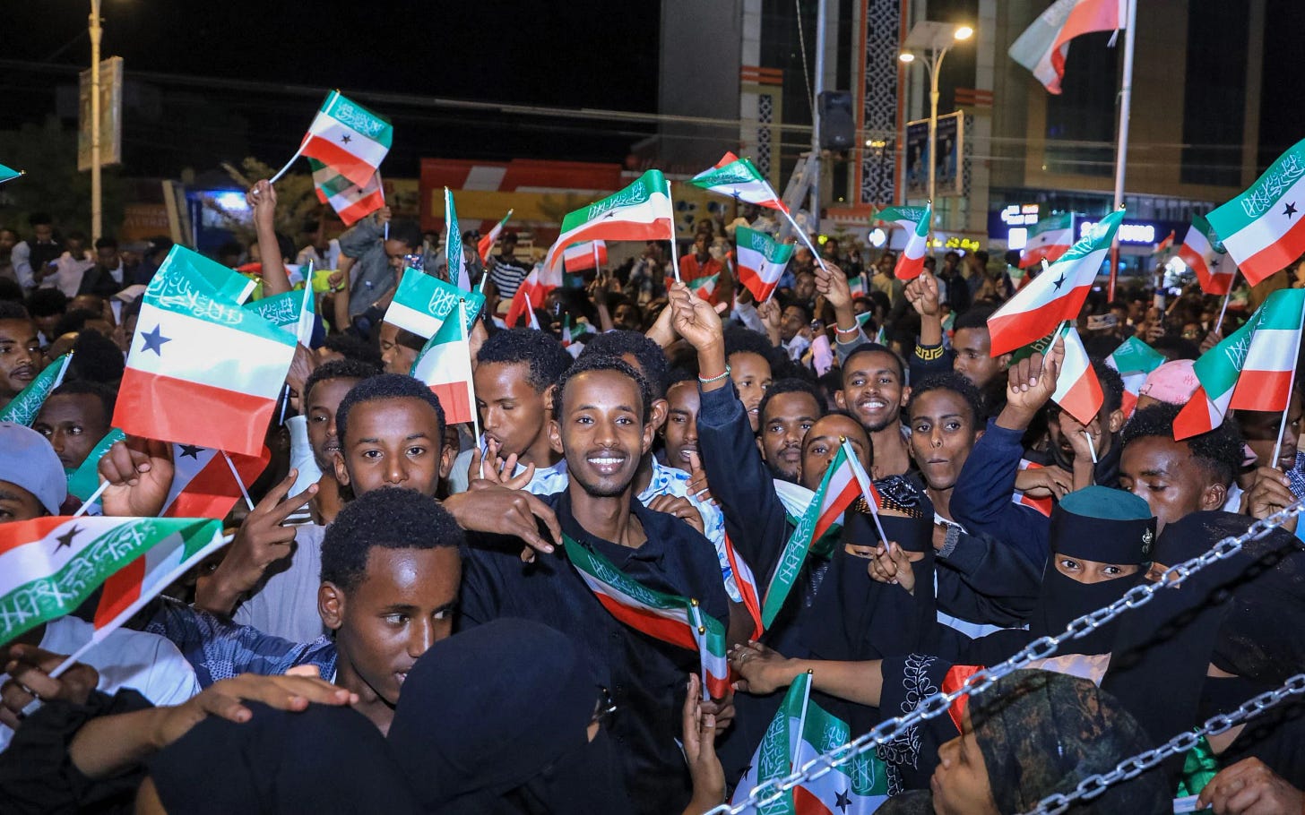 People wave Somaliland flags as they gather to celebrate Israel's announcement recognising Somaliland's statehood in downtown Hargeisa, on December 26, 2025