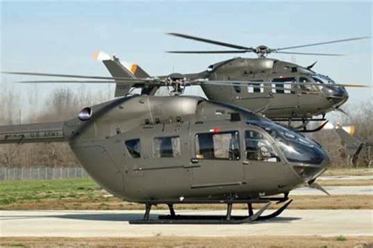 A couple of helicopters on a runway

AI-generated content may be incorrect.