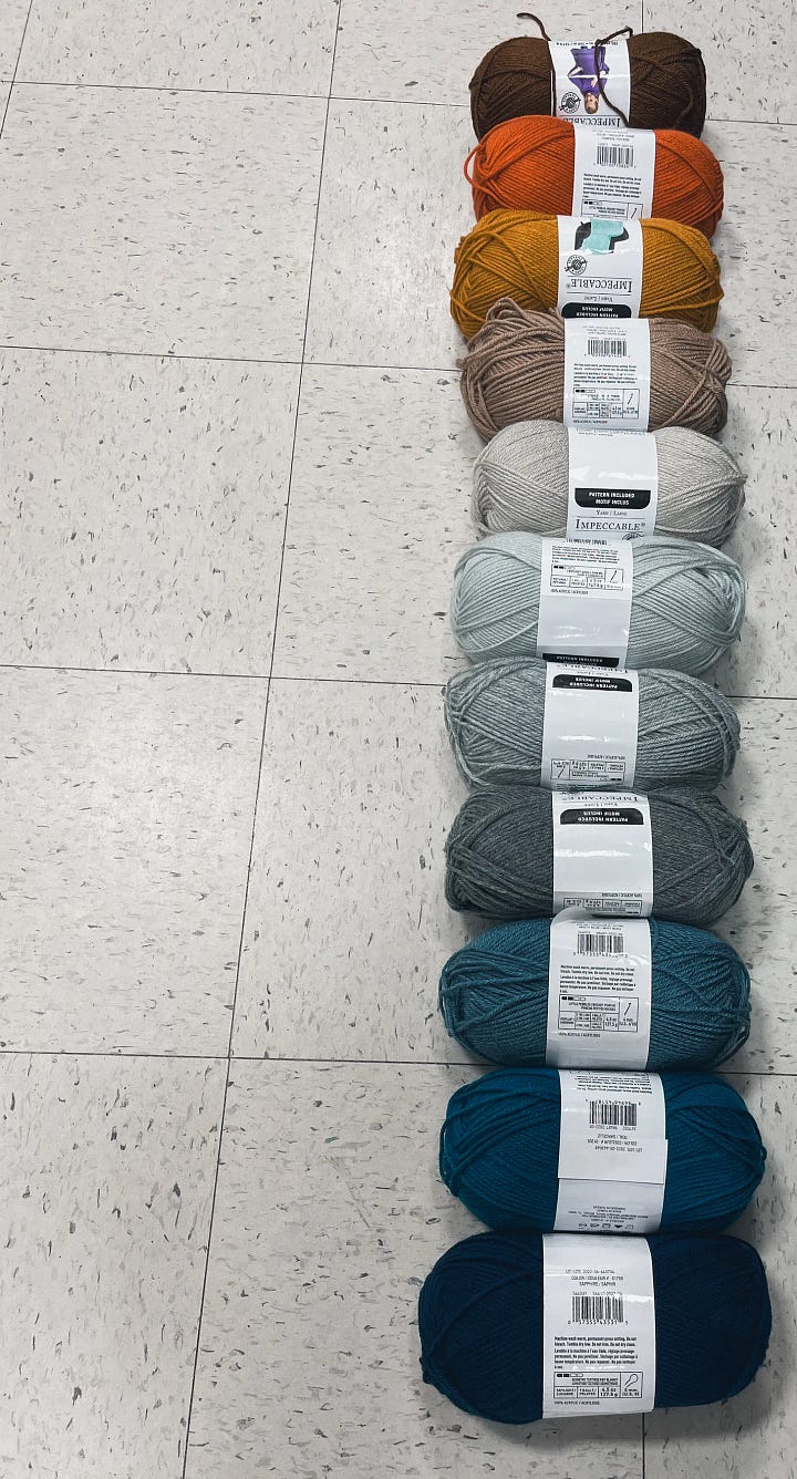 The first image shows 11 balls of yarn as a gradient from chocolate brown through orange, yellow, taupe, and grey, to blues, ending in navy blue, along a store floor. The second photo is the author in black toque, holding a finished crocheted blanket that used the yarn to record the daily high temperatures in 2023.