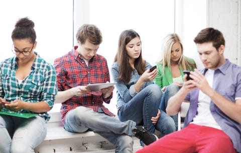 http://www.dreamstime.com/royalty-free-stock-image-students-looking-devices-school-education-internet-concept-their-phones-tablet-pc-image39629856