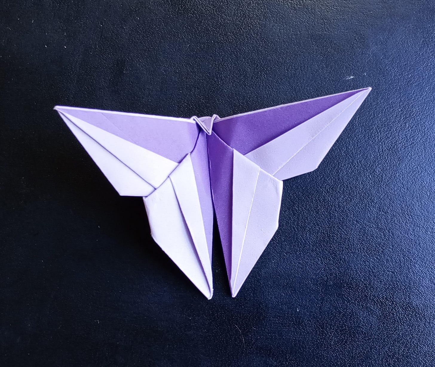 An origami butterfly in 2 shades of purple