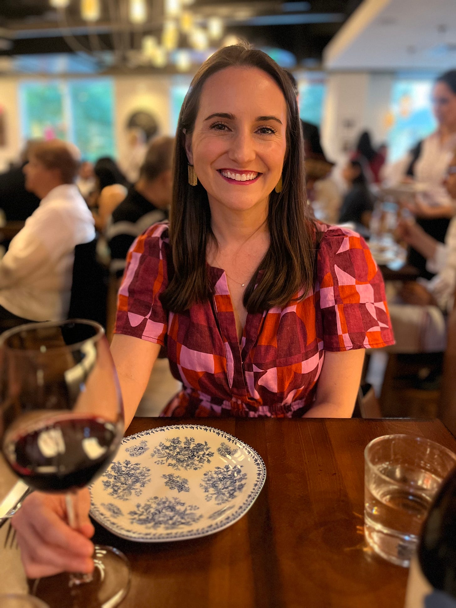 Image of Briana drinking a glass of wine