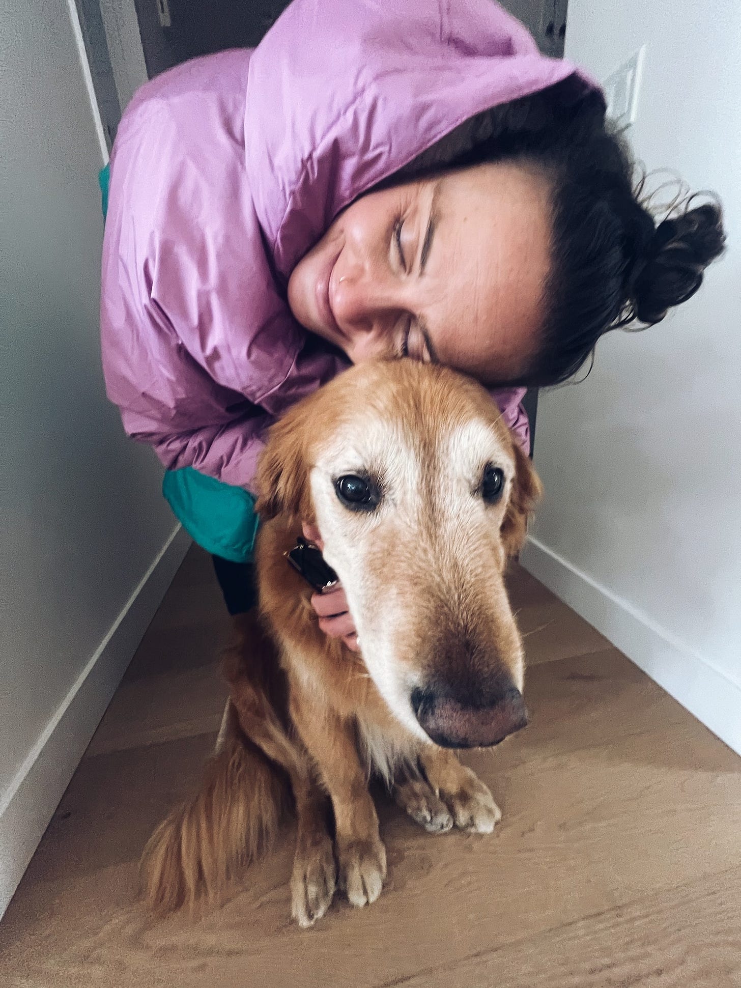 Me hugging an old golden retriever