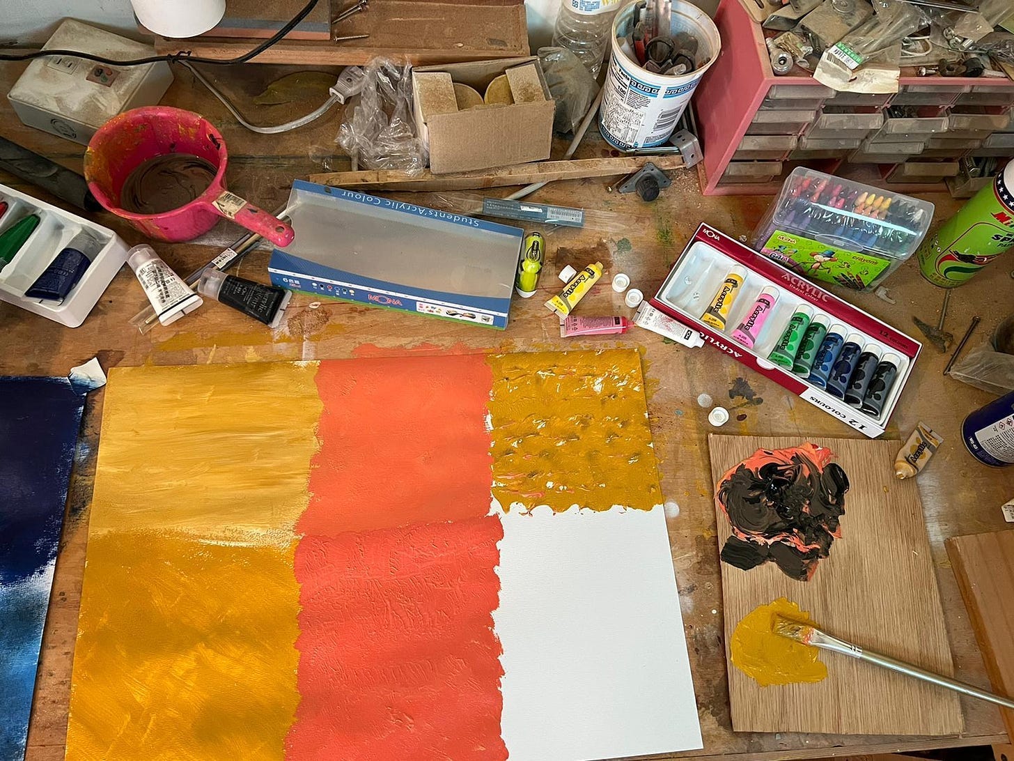 A workshop with painted pallets