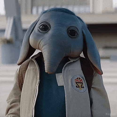 a person wearing an elephant mask and a kepler patch a person wearing an elephant mask and a kepler patch