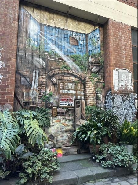 A mural on a brick wall

Description automatically generated