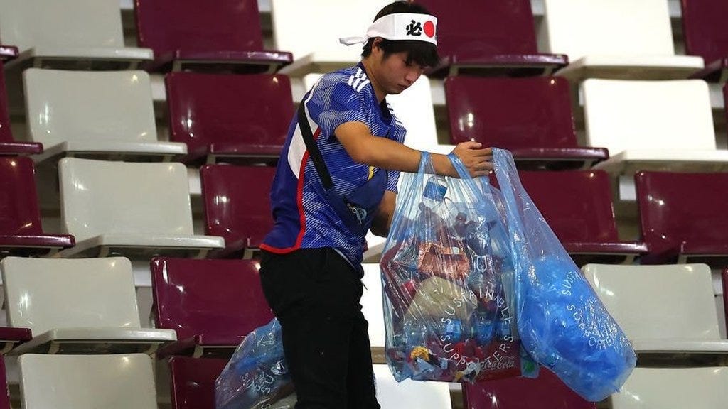World Cup 2022: Japan's fans clean up stadium after win over Germany - BBC  Sport