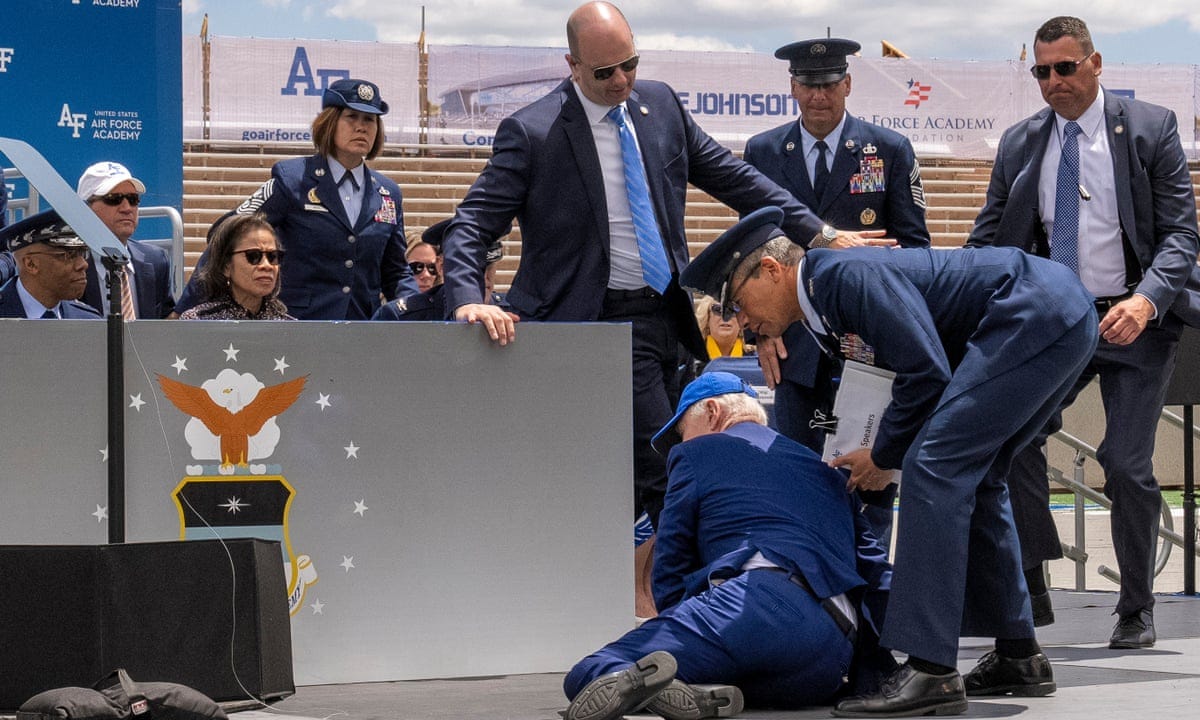 Biden trips and falls at Air Force Academy graduation ceremony | Joe Biden  | The Guardian