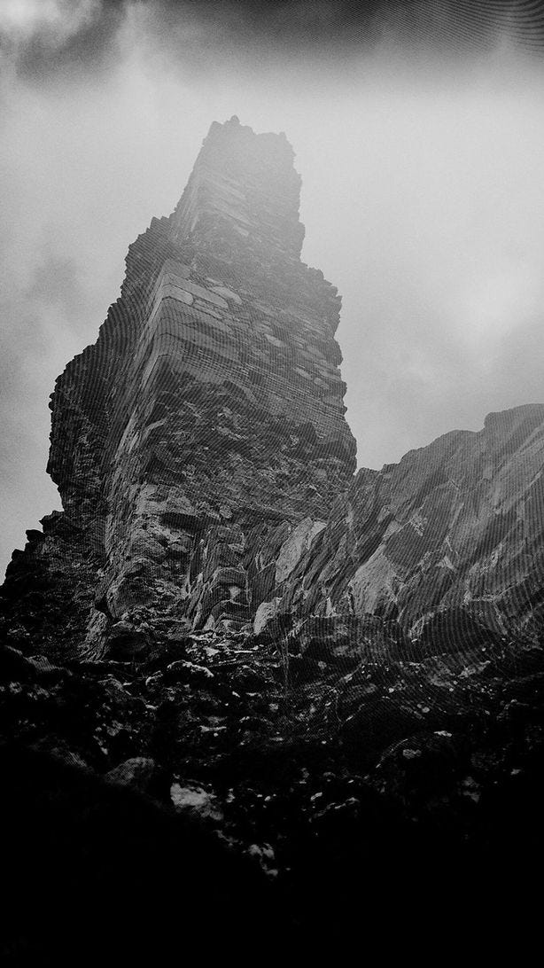 Dramatic black and white view looking up at tower castle ruins representing spiritual breakdown and transformation