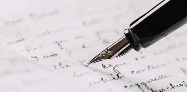 fountain pen on paper with ink text closeup fountain pen on paper with ink text closeup old pen and paper stock pictures, royalty-free photos & images