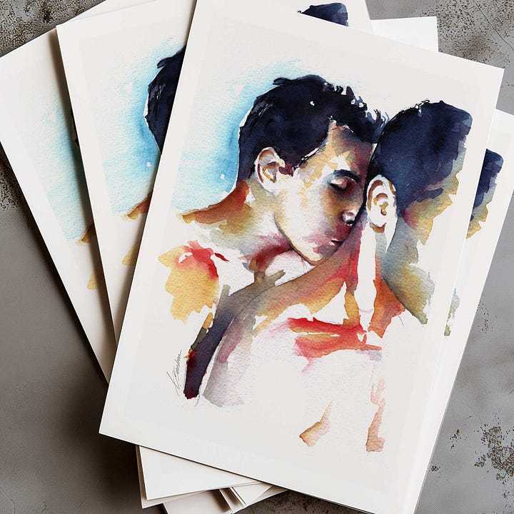 A framed watercolor painting of two men in an intimate embrace, one resting his face against the other's neck. The colors are soft and expressive, blending blues, reds, and warm skin tones.