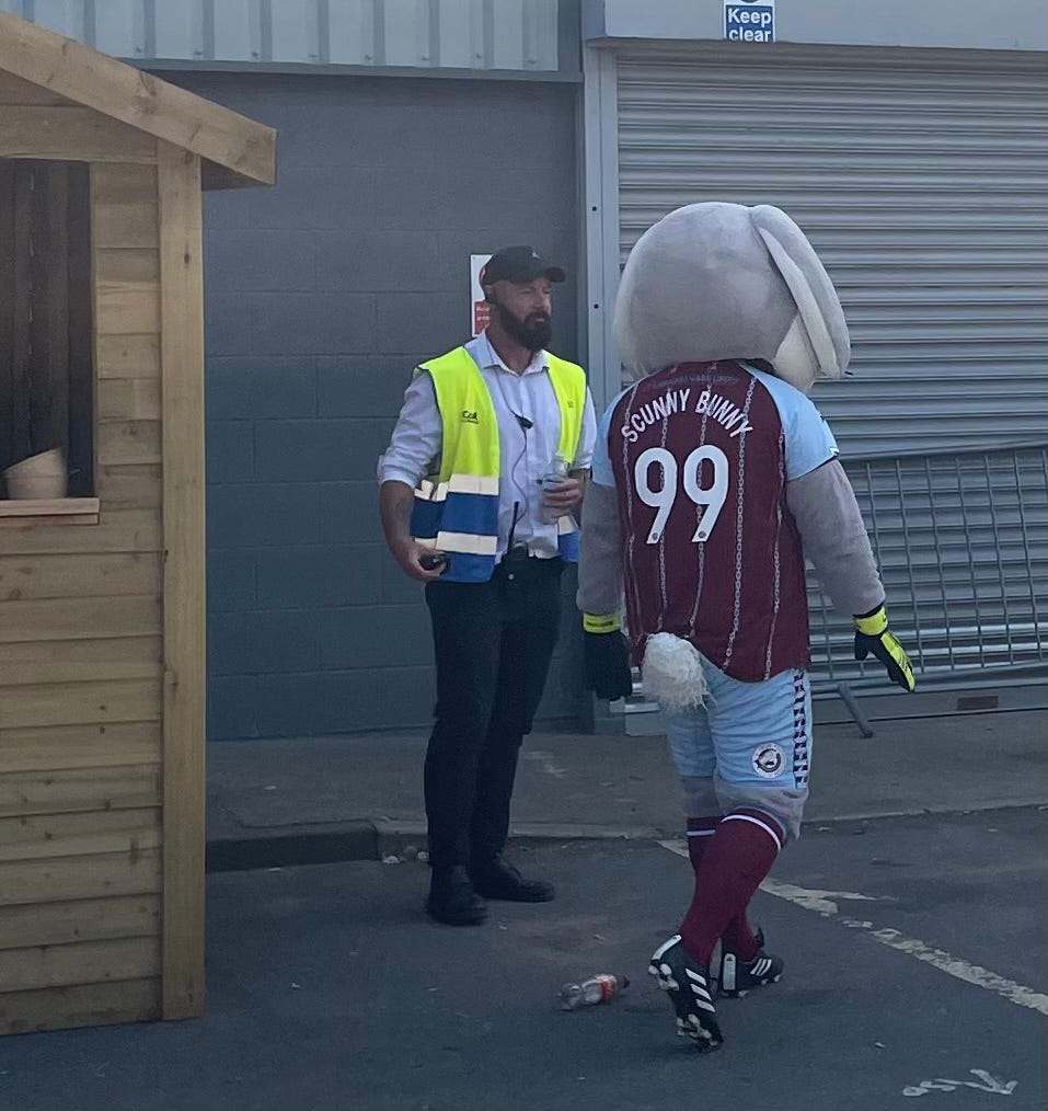 Scunny Bunny, a rather terrifying rabbit mascot, who is wearing the shirt with the pinstripe chains.