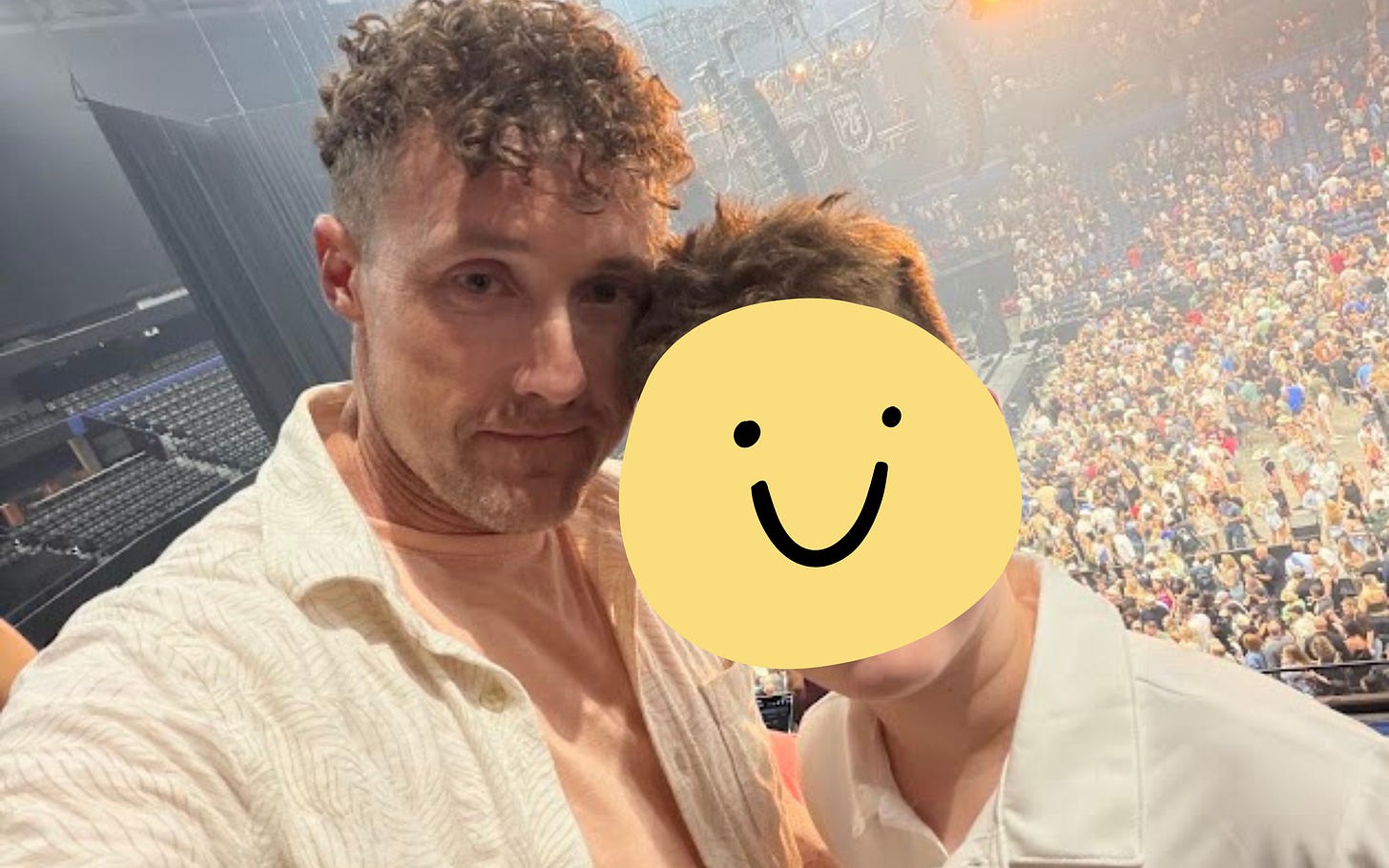 Photo of author in his horse outfit and his son (face obcured) with a concert crowd in the background.