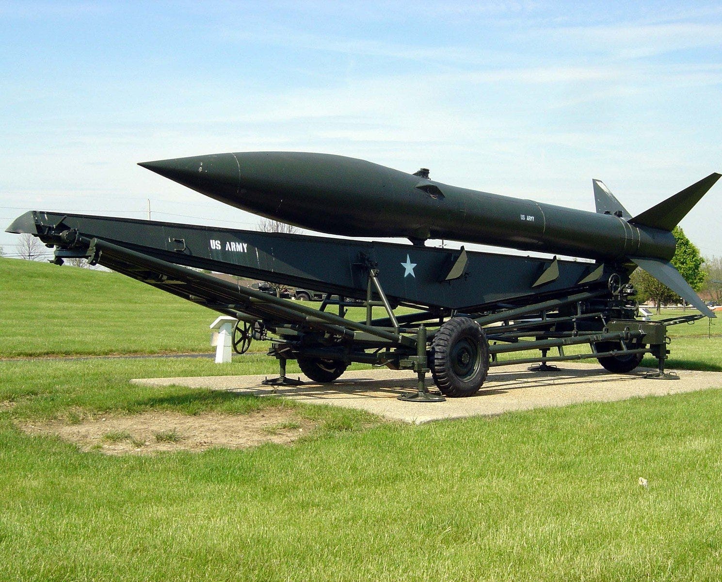 Large black military missle on a platform Large black military missle on a platform
