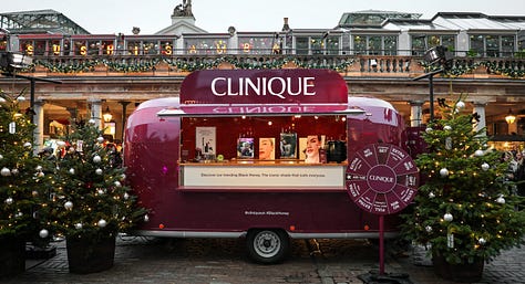 Photos of a maroon Clinique van in Covent Garden and lines of people queuing.