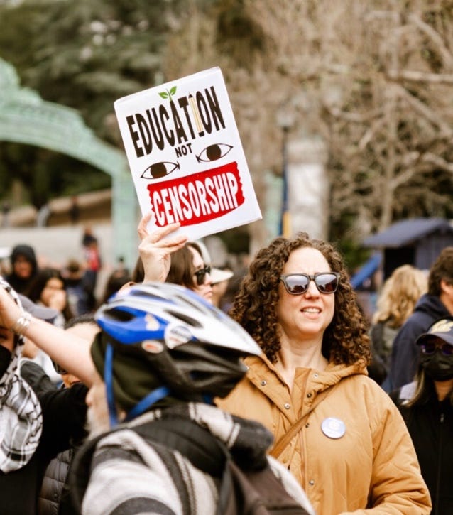 A person holding a sign

AI-generated content may be incorrect.