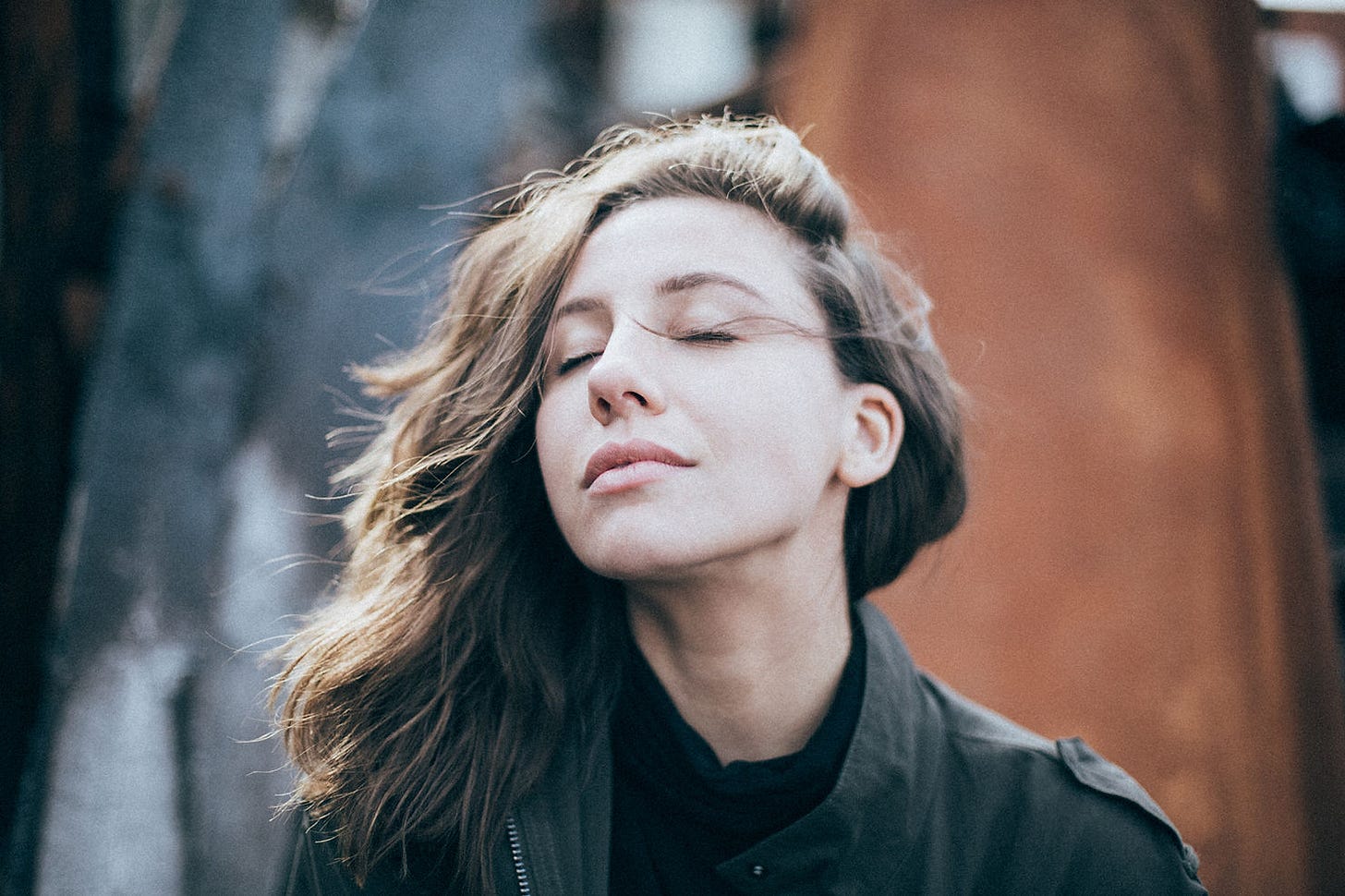 woman with eyes closed breathing deeply