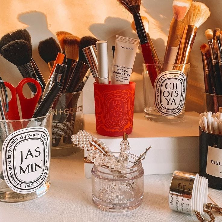 This may contain: there are many makeup brushes and other items on the shelf next to eachother