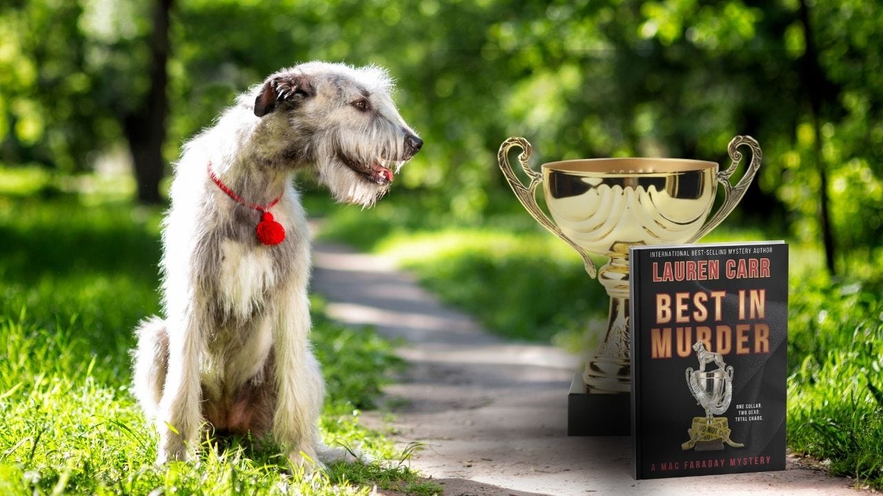 Book "Best in Murder" in front of trophy and next to a Irish Wolfhound