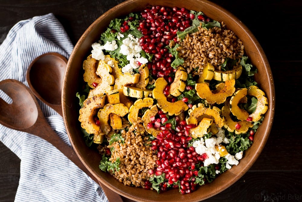 This Autumn Harvest Salad uses the beautiful produce available as the months start to get colder, such as delicata squash, kale, and pomegranates, as well as farro and goat cheese to make a hearty cold weather salad. Then it is all tossed together with a maple apple cider vinaigrette! #ad This Autumn Harvest Salad uses the beautiful produce available as the months start to get colder, such as delicata squash, kale, and pomegranates, as well as farro and goat cheese to make a hearty cold weather salad. Then it is all tossed together with a maple apple cider vinaigrette! #ad