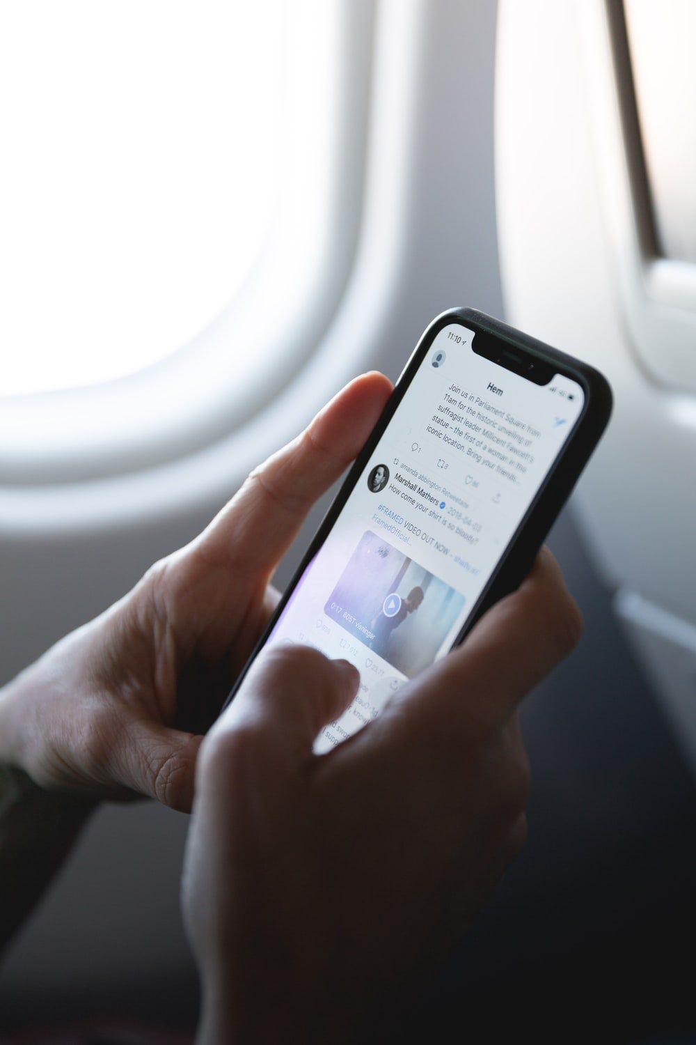 person holding space gray iPhone X person holding space gray iPhone X
