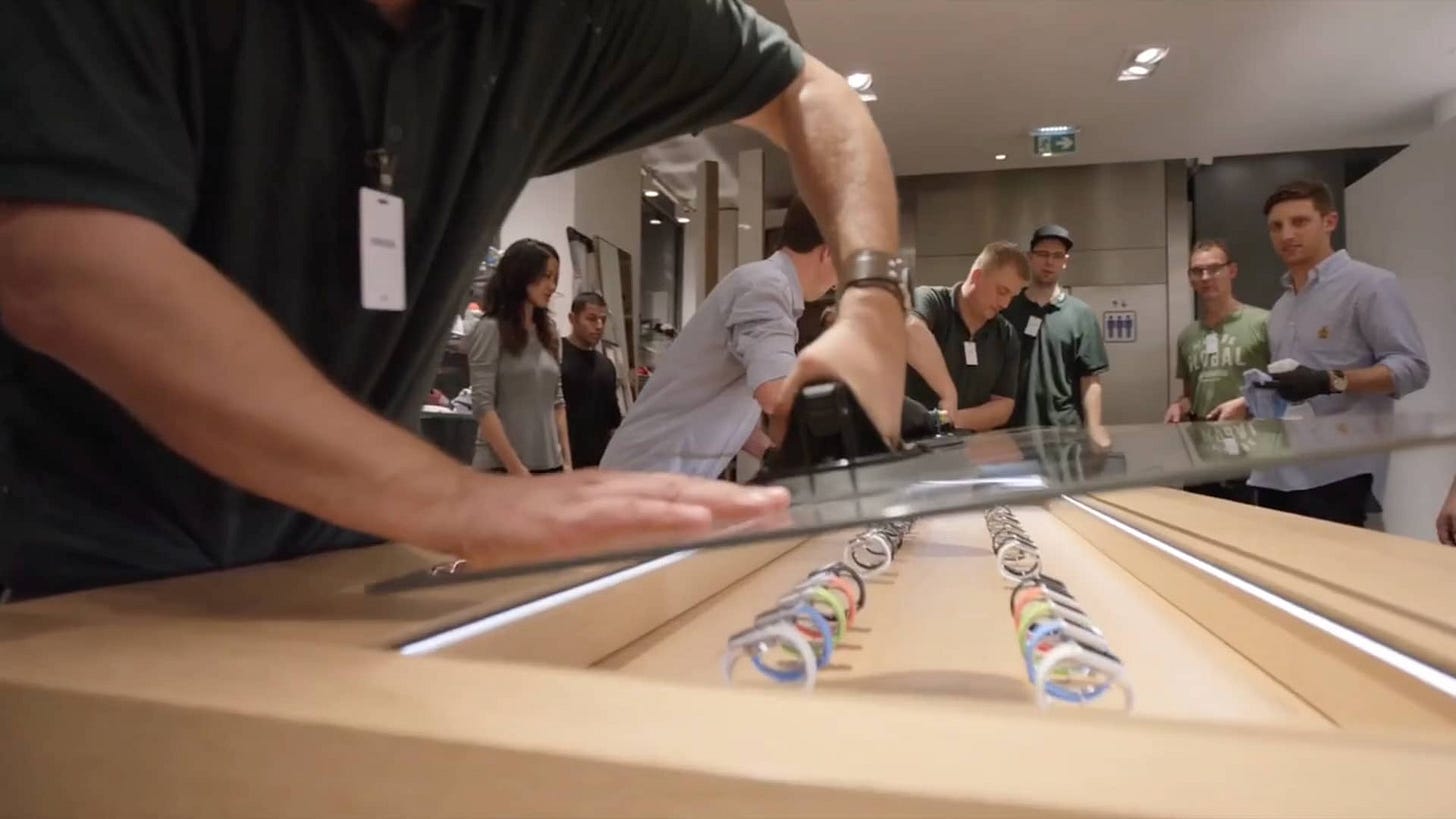 Workers install a piece of glass in the display table at Colette in Paris. Workers install a piece of glass in the display table at Colette in Paris.