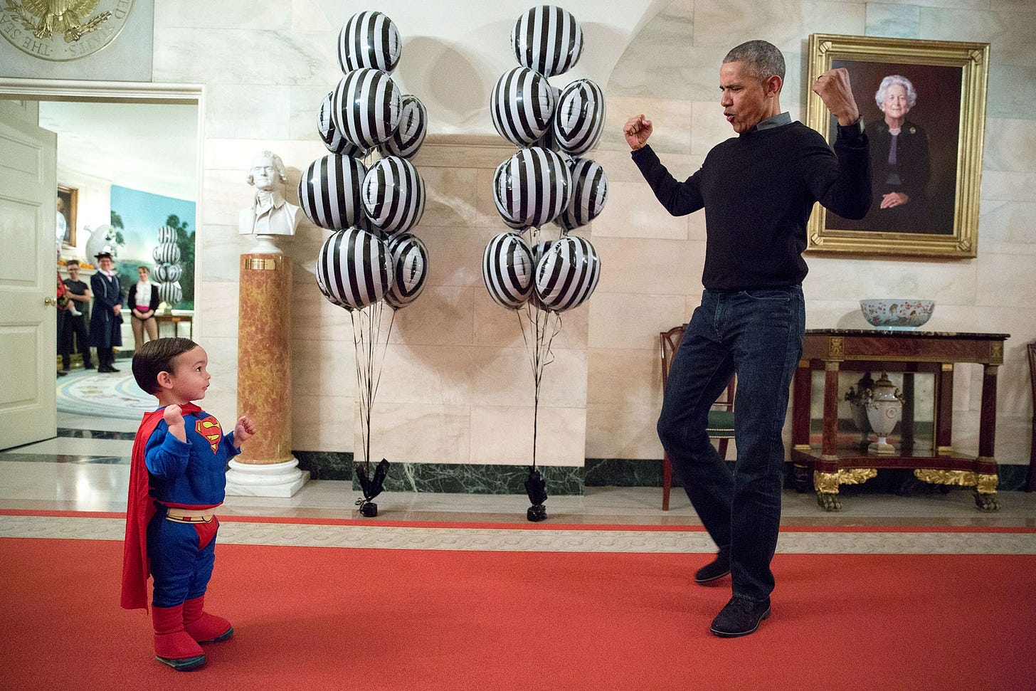 October 31, 2016: President Obama playfully interacts with 'Superman' Walker Earnest, son of Press Secretary Josh Earnest, in the White House corridor, ready to welcome trick-or-treaters on Halloween. October 31, 2016: President Obama playfully interacts with 'Superman' Walker Earnest, son of Press Secretary Josh Earnest, in the White House corridor, ready to welcome trick-or-treaters on Halloween.