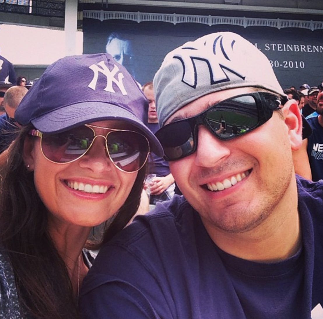 My wife and I taking in a Yanks game My wife and I taking in a Yanks game