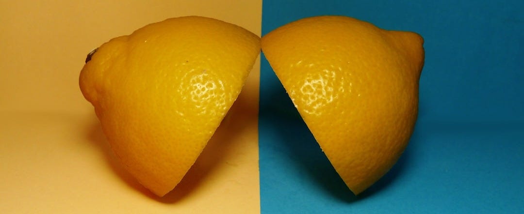 two sliced lemons on surface