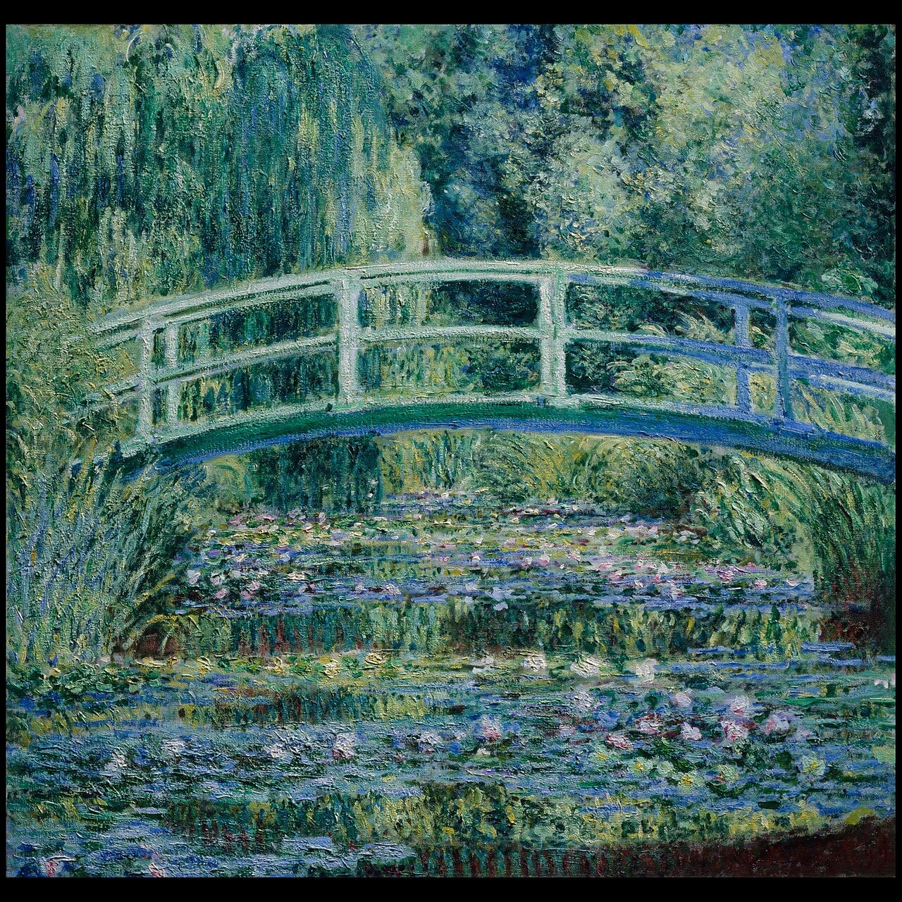 A green footbridge over a pond of water lilies A green footbridge over a pond of water lilies