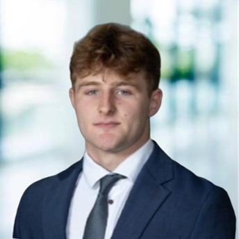 A person in a suit

AI-generated content may be incorrect.