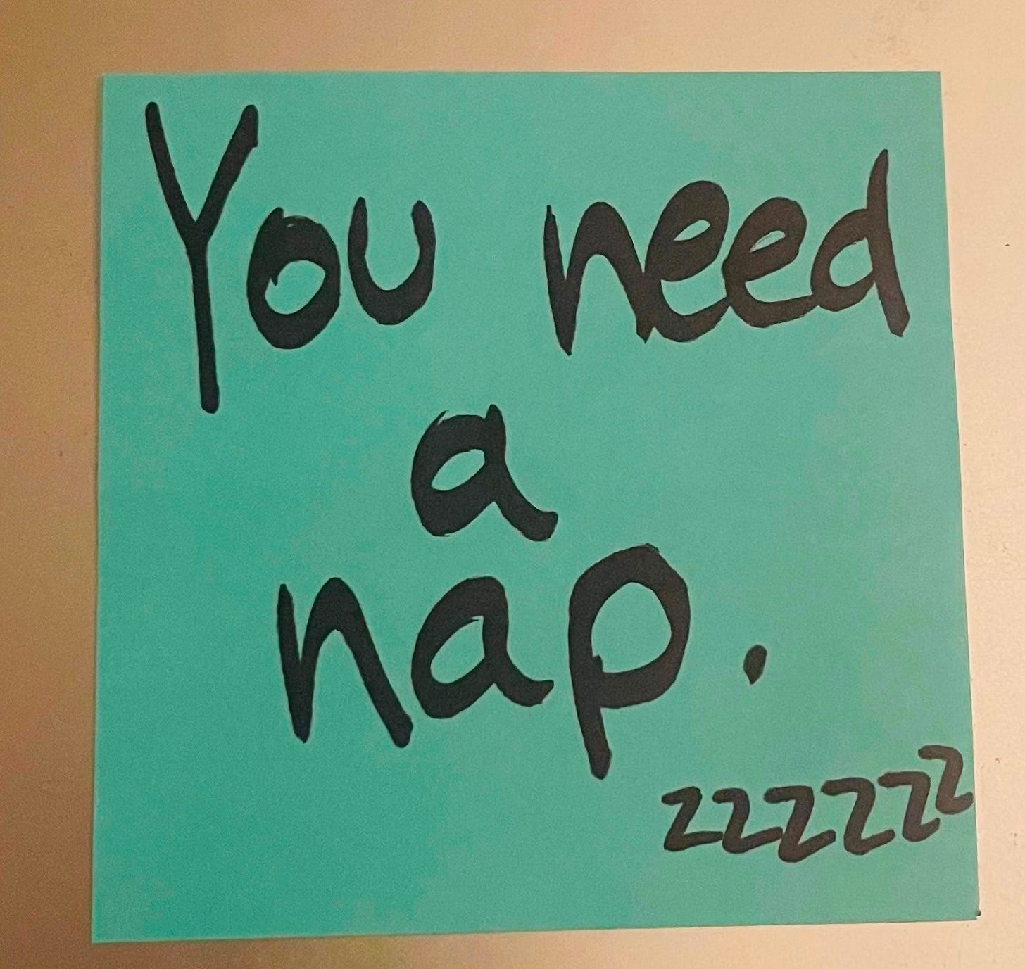 The Post-it says, "You need a nap."