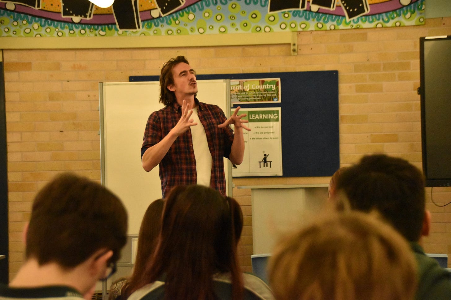 May be an image of 5 people and people studying