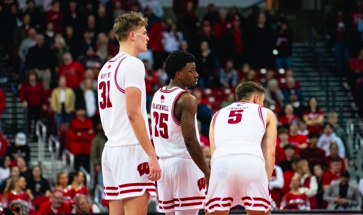 Wisconsin Badgers players Nolan Winter, John Blackwell, and Jack Janicki stand next to each other on the court. Photo credit: UW Athletics Wisconsin Badgers players Nolan Winter, John Blackwell, and Jack Janicki stand next to each other on the court. Photo credit: UW Athletics