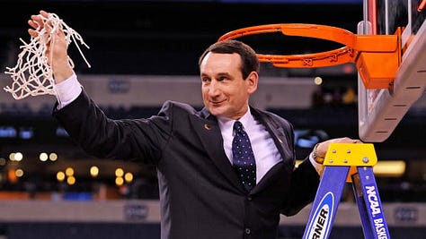 Coach K cutting the nets